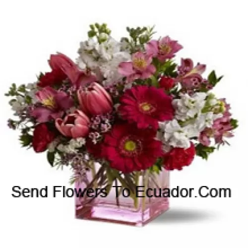 Red Roses, Red Tulips And Assorted Flowers With Seasonal Fillers Arranged Beautifully In A Glass Vase