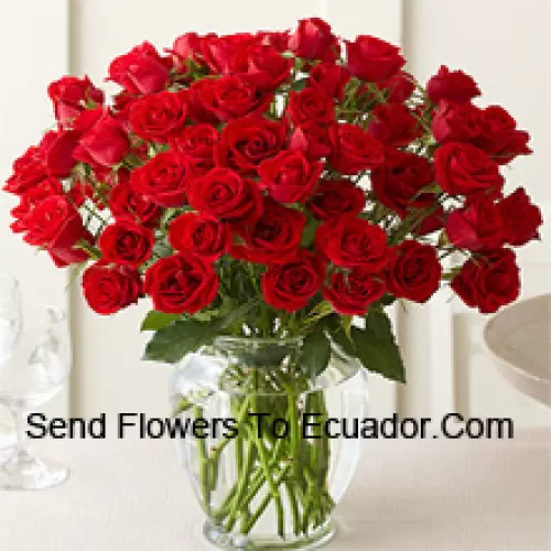 51 Red Roses With Some Ferns In A Glass Vase